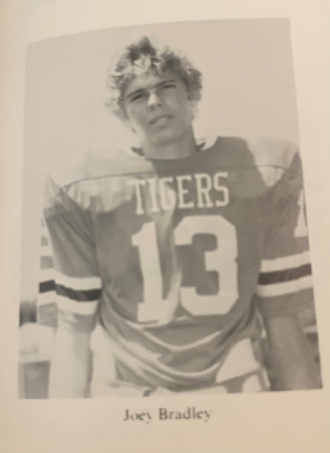Joel D. Bradley in his high school football uniform, number 13