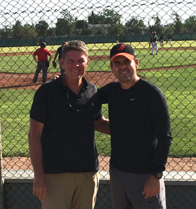 Between innings with a fellow scout — the conversations that become chapters.