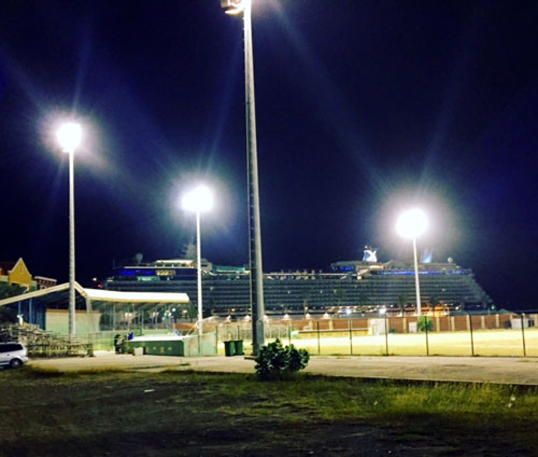 Night lights over a Curaçao field — where the next generation begins.